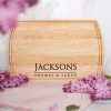 A wooden cutting board with the name jacksons on it.