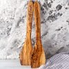 Two wooden spoons with names on them.